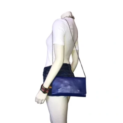 bolso clutch cuero azul negro Foto 1 de 4