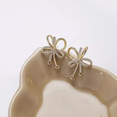 Pendiente de arco pavé de circonita cúbica de 2 piezas, poste de pendiente de pajarita de circonita cúbica, pendiente de circonita cúbica Foto 1 de 4