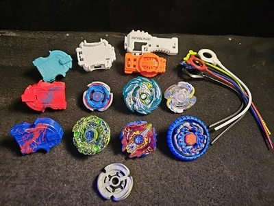 Bayblade Lot Burst and Metal Beyblades, Rip Cords, And Parts - Image 1 of 4