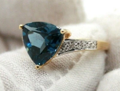 ANILLO DE COMPROMISO CON DIAMANTES DE TOPACIO AZUL CORTE BILLÓN ORO AMARILLO 14K PARA DAMA Foto 1 de 4