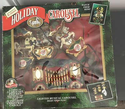 Conjunto musical iluminado carrusel navideño vintage Mr. Christmas 3 figuras 21 villancicos Foto 1 de 4