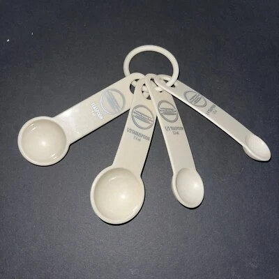 KitchenAid Measuring Spoons - Plastic (Set of 4 Spoons) Cream With Silver Logo - Image 1 of 4