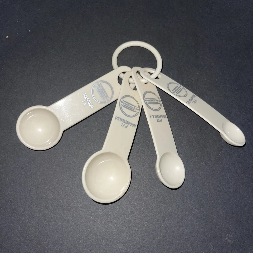 KitchenAid Measuring Spoons - Plastic (Set of 4 Spoons) Cream With Silver Logo - Image 1 of 4