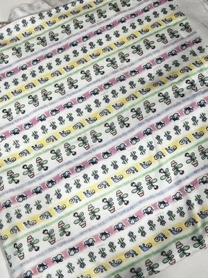 White Knit Fabric with Snails, flowers and Butterflies 60" wide by 1.5 yards - Image 1 of 3