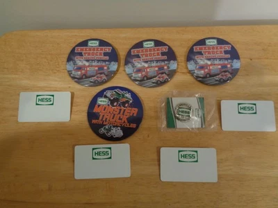 HESS OIL COMPANY 9 PIECE LOT 4 NAME TAGS 4 TRUCK BUTTONS 1 SERVICE CHAMPION PIN - Image 1 of 4