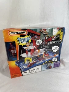 2007 MATCHBOX DIECAST POP UP ADVENTURE SET - AUTO CENTER M6164 SEALED RED TRUCK - Bild 1 von 7