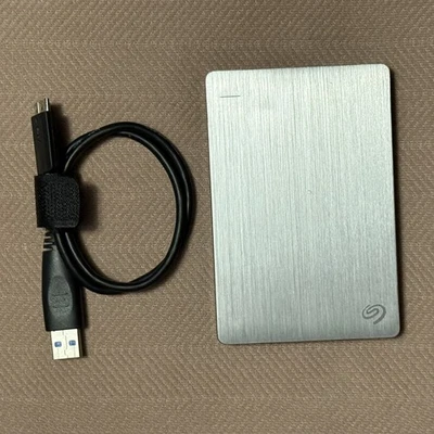 Seagate Backup 1TB Portable External Hard Drive USB 3.0 – Black Pre-Owned Tested - Image 1 of 4