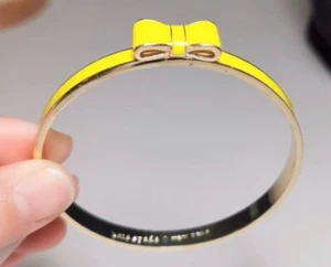 NEW Kate Spade Take a Bow Enamel Bangle Bracelet Bright Yellow - Picture 1 of 3