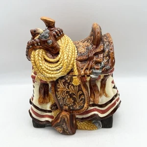 Western Saddle Ceramic Cookie Jar Cowboy Cowgirl Wrangler Rope & Belt Detail NIB - Picture 1 of 17