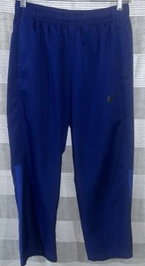 Pantalones cortavientos de entrenamiento Nike para hombre azul marino tejido seco medianos - Imagen 1 de 5
