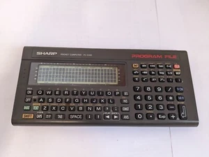 sharp PC E200 s'allume pocket computer - Photo 1/5