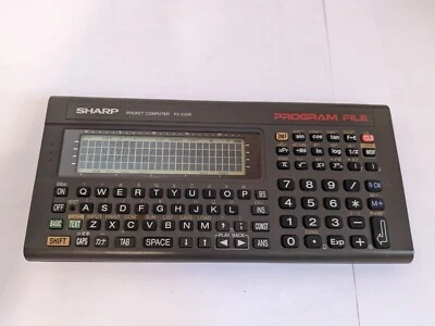 sharp PC E200 s'allume pocket computer - Photo 1/4
