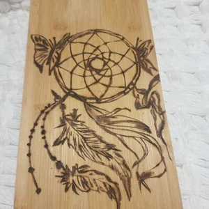 Wood burning on a serving board with a dream catcher design - Picture 1 of 2