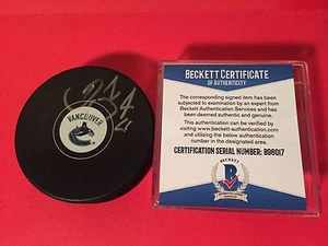 Disco de hockey firmado Daniel Sedin Canucks automático Beckett certificado certificado de autenticidad - Imagen 1 de 2