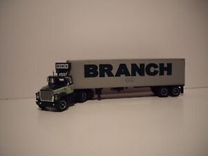 DCP FIRST GEAR 1/64 BRANCH LOGOED FORD LT-9000 DAY CAB WITH 40' VINTAGE DRY VAN