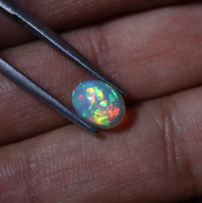 Cabujón ovalado de ópalo etíope 1,3 quilates 8,8 x 6,7 x 4,2 mm natural AAA fuego multi flash Foto 1 de 4