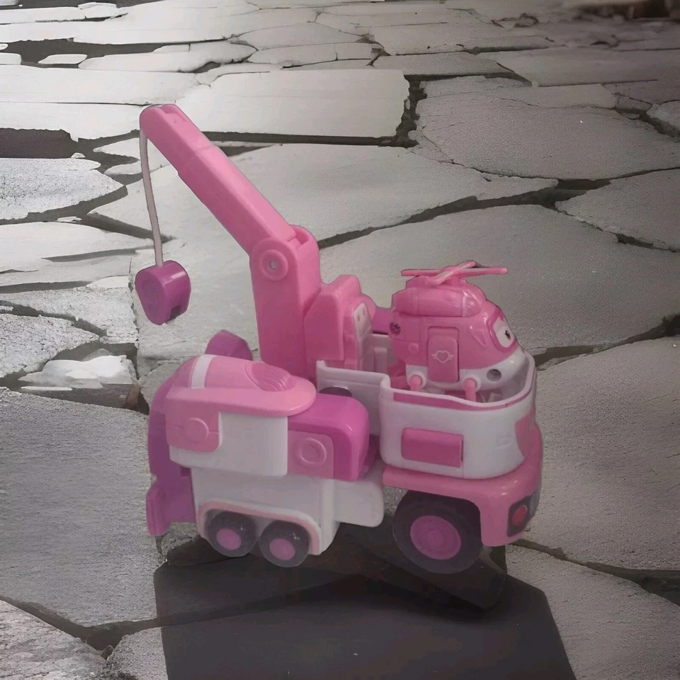 Remolque de rescate Super Wings Dizzy's con mini figura rosa y avión transformador Foto 1 de 4