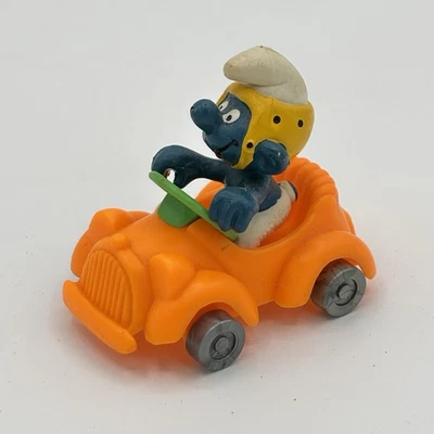 Estatueta rara vintage aplausos motorista de carro Smurf laranja PVC - Imagem 1 de 4