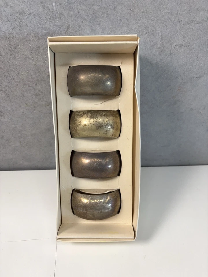 Juego de 4 servilleteros redondos placa plata pier 1 imports Foto 1 de 4