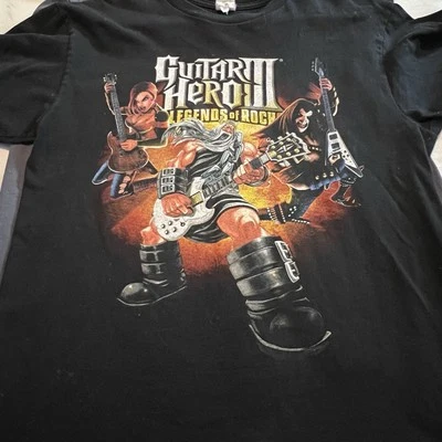 "Camiseta promocional de videojuegos Guitar Hero 3 de la década de 2000 etiquetada XL 20""x25,5""" Foto 1 de 4