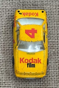 Coche diecast vintage Kodak Film Oldsmobile Delta 88 Race Cat COMO SE LEE - Imagen 1 de 8