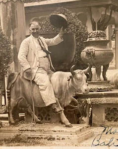 Bali INDONESIA Real Photo Postcard RPPC Man on Ox Statue At Shrine Tips His Hat - Picture 1 of 3
