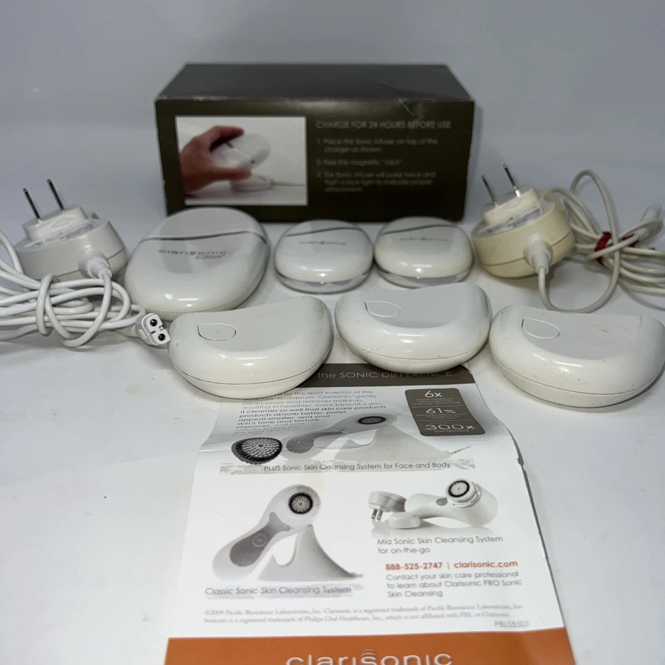 Lote de 6 cargadores de infusión sónicos Clarisonic Opal con 2 adaptadores de CA y caja Foto 1 de 4