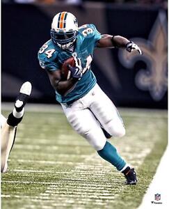 Ricky Williams Miami Dolphins Unsigned Teal Jersey Running 16" x 20" Photo