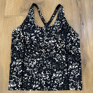 Reggiseno sportivo Fabletics stampa splatter canotta media incrociata schiena - Foto 1 di 6