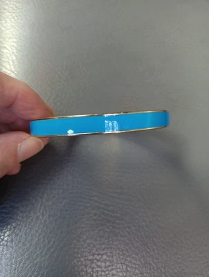 Brazalete Kate Spade con Bisagras Cabeza en las Nubes Tono Dorado Azul Turquesa Esmalte Foto 1 de 4