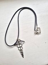 A Black Faux Leather Necklace With A Caduceus Symbol Pendant. Unisex.
