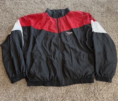 Chaqueta cortavientos vintage Reebok para hombre talla XL negra roja bloques de colores cremallera Foto 1 de 4