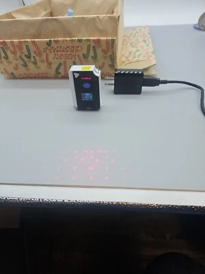 Brookstone CTX (Model: VK200 Keyfob) BT Virtual Bluetooth Keyboard - Image 1 of 4