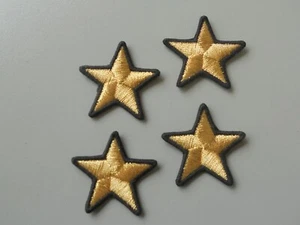 PATCH STELLINE PZ 4 RICAMATE ORO BORDINO NERO CM 5 TERMOADESIVE - Imagen 1 de 1