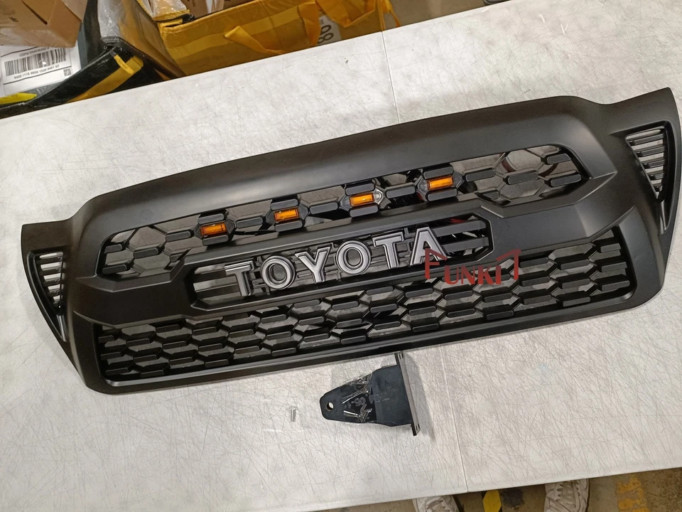 Parrilla delantera para parachoques Tacoma 2005-2011 rejilla de malla negra mate con 4 luces LED Foto 1 de 4