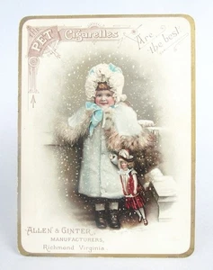 Victorian PET Cigarettes Allen & Ginter Snowy Winter Girl with Doll Trade Card - Foto 1 di 4