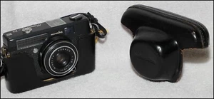 RARE! Minolta Minoltina - P (black) w/ custom leather case. Shutter, focus work - Picture 1 of 3