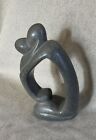 Polished Gray Stone Embrace Sculpture