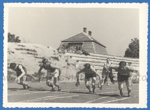 Handsome guys athletes run through the stadium Vintage photo