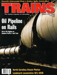 TRAINS 8/94 GE U25B, CONRAIL INTERMODAL, SP TANK TRAIN OIL CANS, N.C. STEAM - Picture 1 of 2
