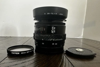 Minolta Maxxum 35-70 MM F4 Macro AF Lens, w/ front & rear caps, and lens hood - Image 1 of 4