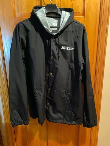 UFC Mens Water-Resistant Nylon Hooded Windbreaker L, Black "Train Different" Cover