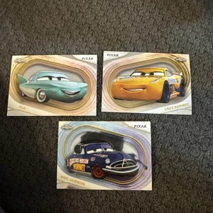 2025 Topps Chrome Disney Cars Flo, Cruz Ramirez & Doc Hudson 51, 53, 54 - Bild 1 von 2