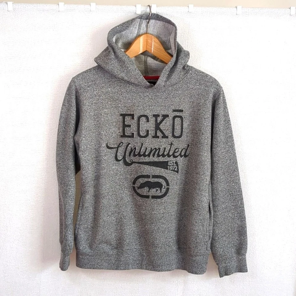 Sudadera con Capucha Ecko Unlimited Niños Talla Grande Gris con Bolsillos Gráficos Elevados Usada en Excelente Condición Foto 1 de 4