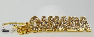 CANADA GOLD TONE WITH CLEAR RHINESTONES KEYCHAIN SOUVENIR - Bild 1 von 2
