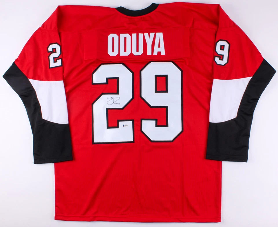 Johnny Oduya Signed Senators Jersey (Beckett COA) Playing career 	1999–present - Image 1 of 1
