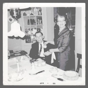 Found Photo 1960's Couple At Kitchen Table Flower Light Fixture  3.5 x 3.5  - Picture 1 of 2