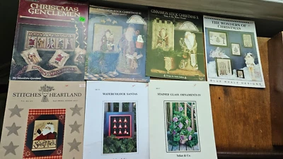LOT OF 7 VINTAGE CROSS-STITCH PATTERN BOOKLET CHRISTMAS CinnamonStick Santa Nick - Image 1 of 4