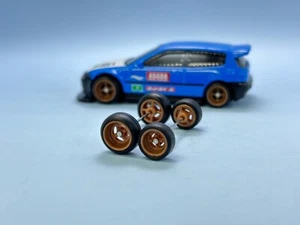 R461 Hotwheels 1/64 Real riders# Donut 4 Spoke Bronze 8/10mm Long Rubber Wheels - Picture 1 of 3