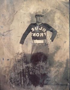 1870s BASEBALL SUBJECT TINTYPE PHOTO OF PLAYER WEARING TEAM JERSEY "BLUE FRONT"